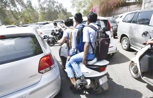 DoE bans students riding two-wheelers to school