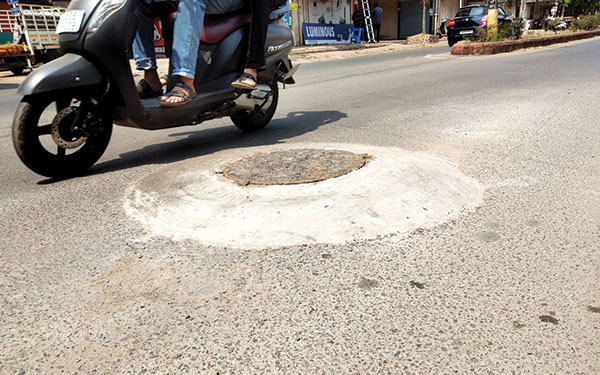 Sewerage manhole covers in Vasco above road-level!
