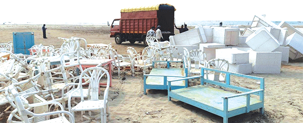 Tourism Dept seizes 10 truckloads of unauthorised deck beds, umbrellas from Morjim Beach