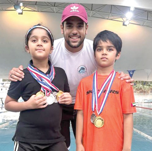 Twins Rachel, Troy shine at Dubai swimming