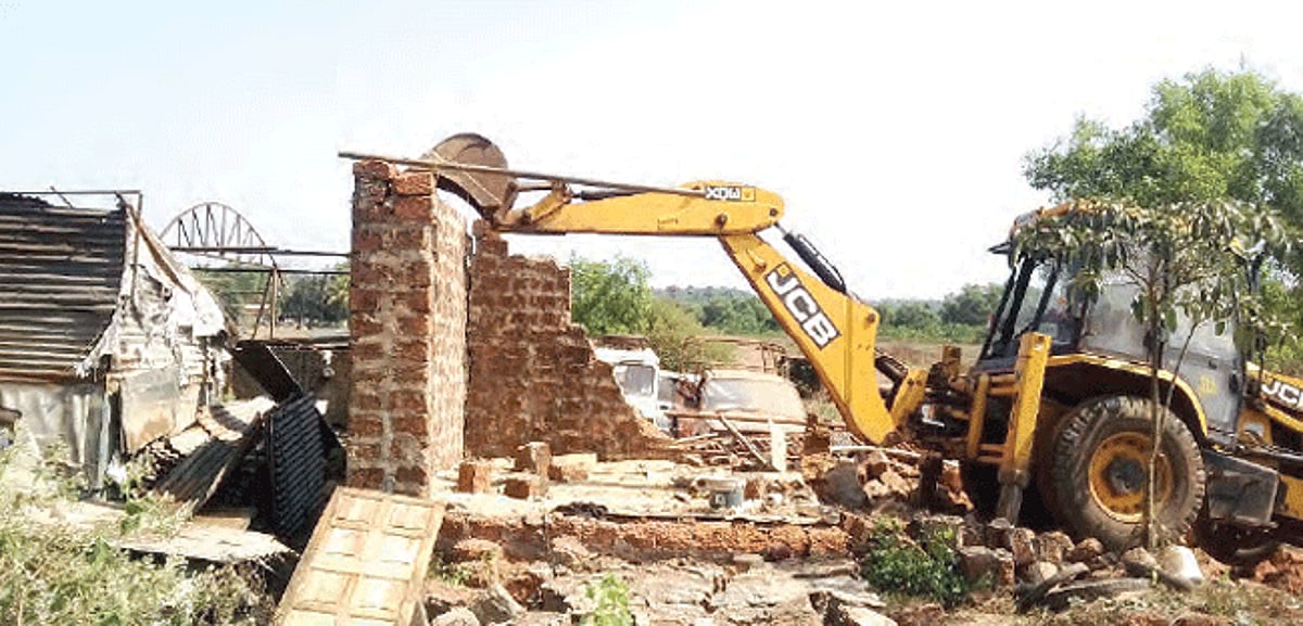A JCB clears a controversial scrap yard at Karaswada-Mapusa on Monday