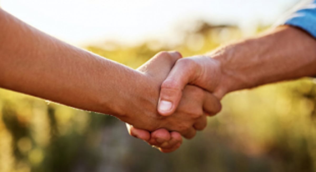 A LAUREL AND HEARTY HANDSHAKE