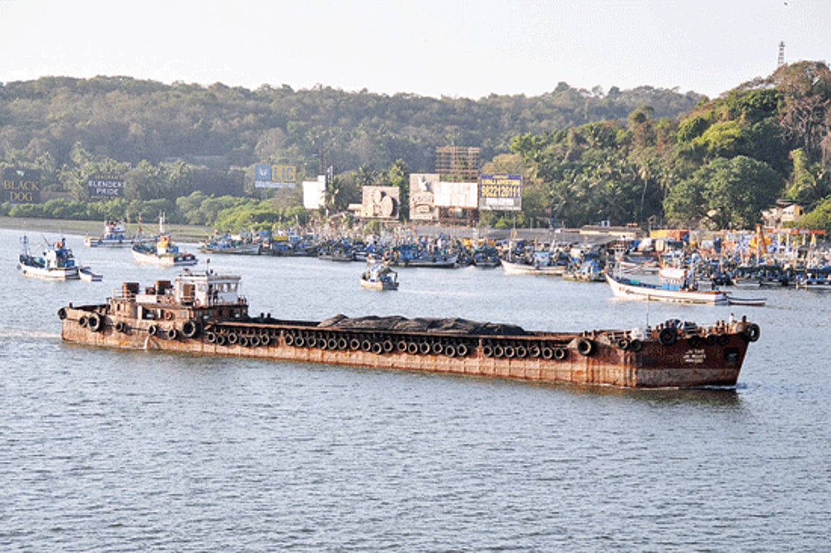 A barge transporting ore in the River Mandovi