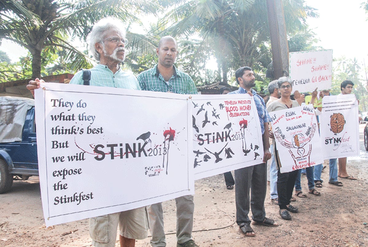 A group of public spirited citizens holding placards protest against the Think Fest at Bambolim on Friday.