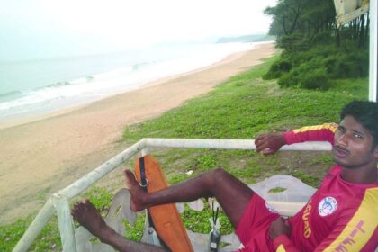 A lifeguard stationed at the watch tower along the empty Galgibaga beach.