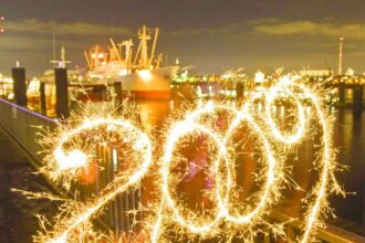 A long exposure photograph shows 2009 written with a sparkler at St Pauli landing bridges in Hamburg, Germany. The world ushered in the New Year with traditional pomp, festivity and fireworks.