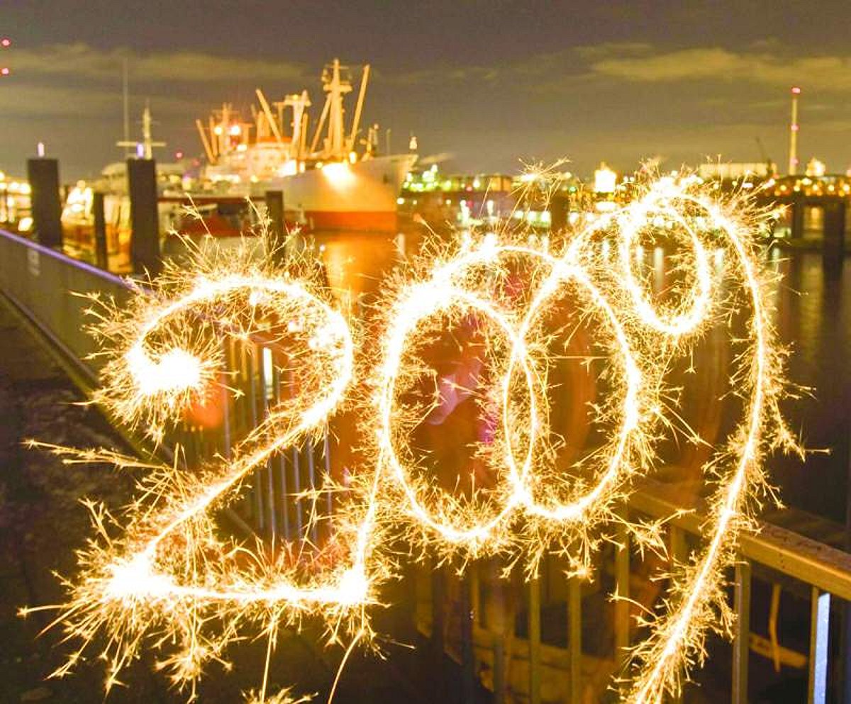 A long exposure photograph shows 2009 written with a sparkler at St Pauli landing bridges in Hamburg, Germany. The world ushered in the New Year with traditional pomp, festivity and fireworks.