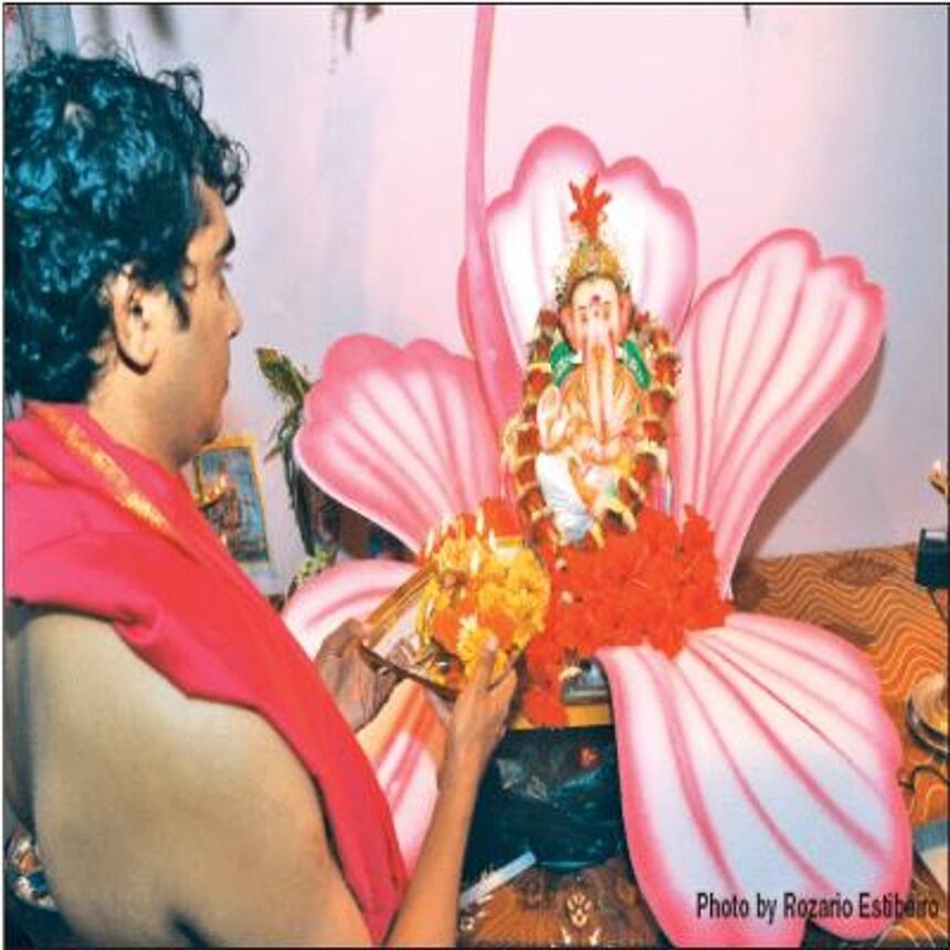 A man performing pooja on the occasion of Ganesh Chaturthi in the city.