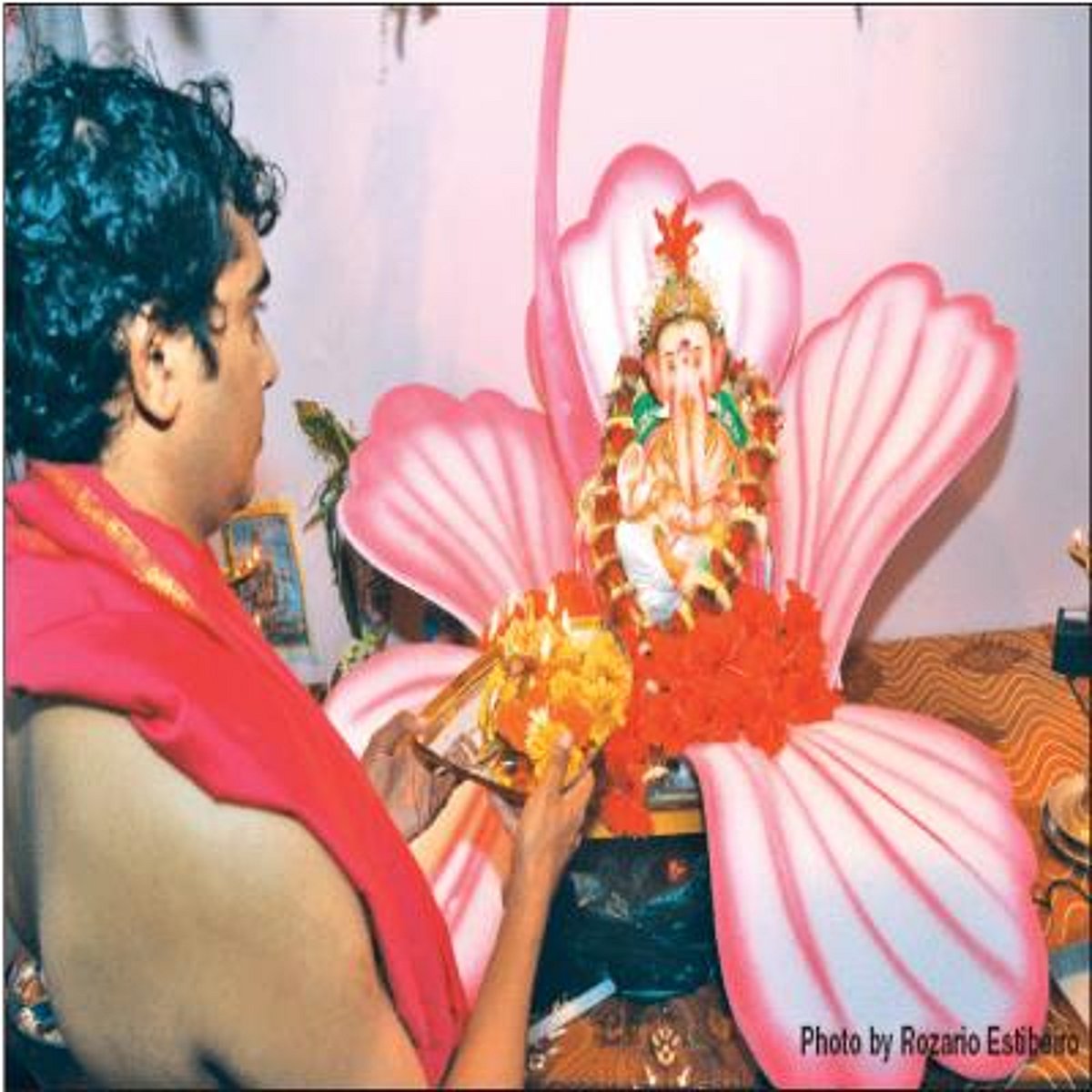 A man performing pooja on the occasion of Ganesh Chaturthi in the city.