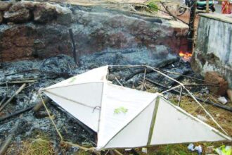 A star stands amid charred remains of a crib gutted in a major fire at Ambaji-Fatorda, on Friday. Photo by Savio Dias