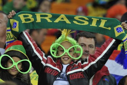 A supporter of Brazil cheers for his team during the match between Brazil and Ivory Coast on Sunday at Soccer City stadium in Soweto.