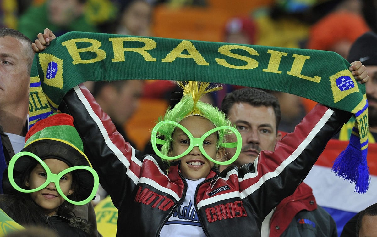 A supporter of Brazil cheers for his team during the match between Brazil and Ivory Coast on Sunday at Soccer City stadium in Soweto.