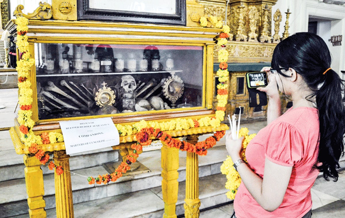 A tourist captures an image of relics of Blessed Rudolf Acquaviva, a Italian Jesuit missionary to India and his  companions who  were martyred at Cuncolim are kept at the Basilica of Bom Jesus at Old Goa, on Tuesday.