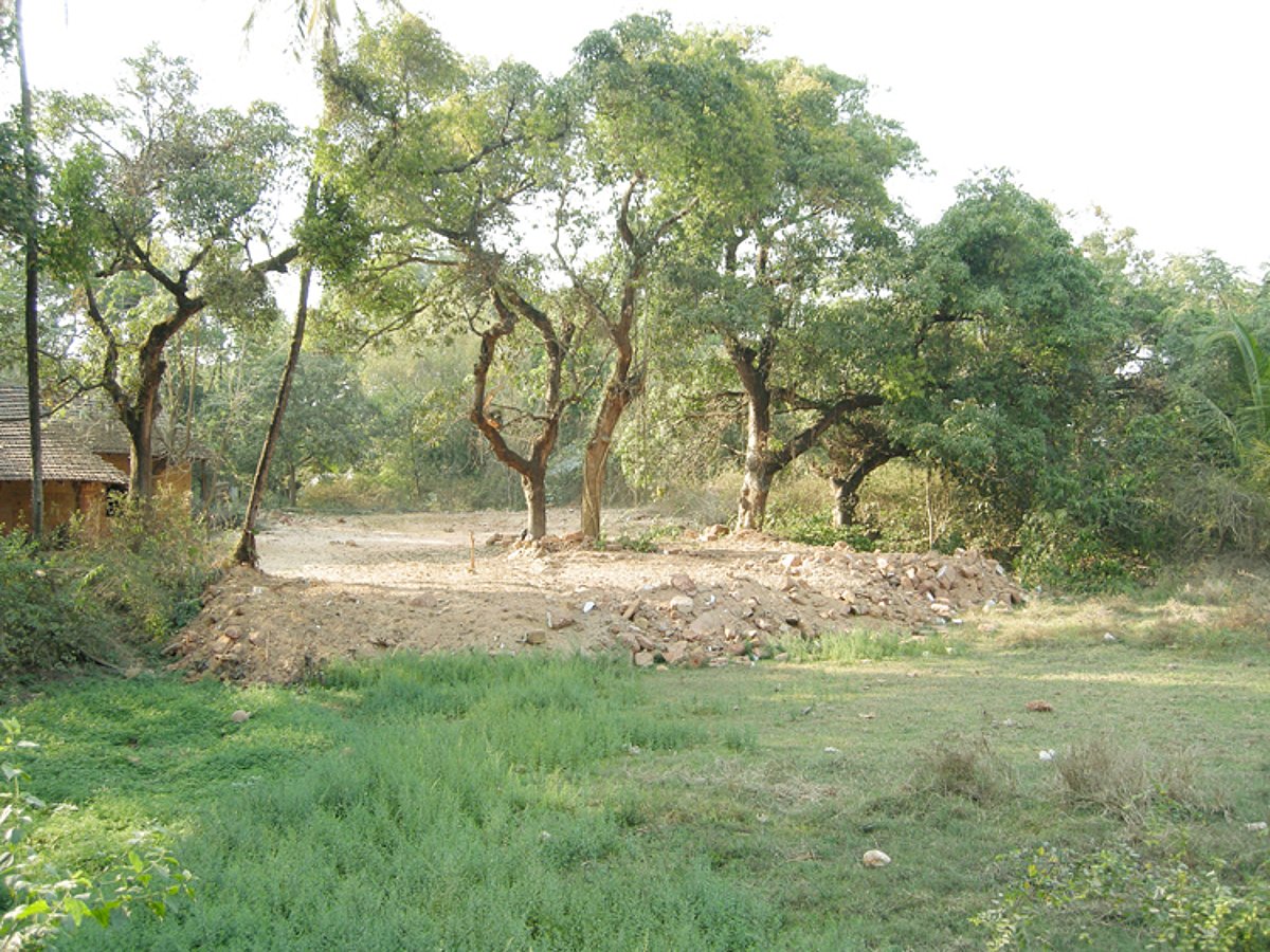 A view of the partially filled up paddy field.
