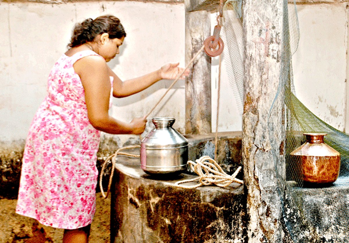 A woman fetches water from a drinking well at Madel-Margao following the breakdown of the Selaulim water pipeline at Raia on Saturday.