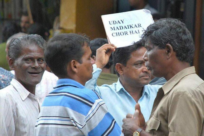 A worker displays a placard, expressing his resentment towards a corporator outside the CCP building in Panjim on Friday. Photo by Rozario Estibeiro 1 A worker displays a placard, expressing his resentment towards a corporator outside the CCP building in Panjim on Friday. Photo by Rozario Estibeiro