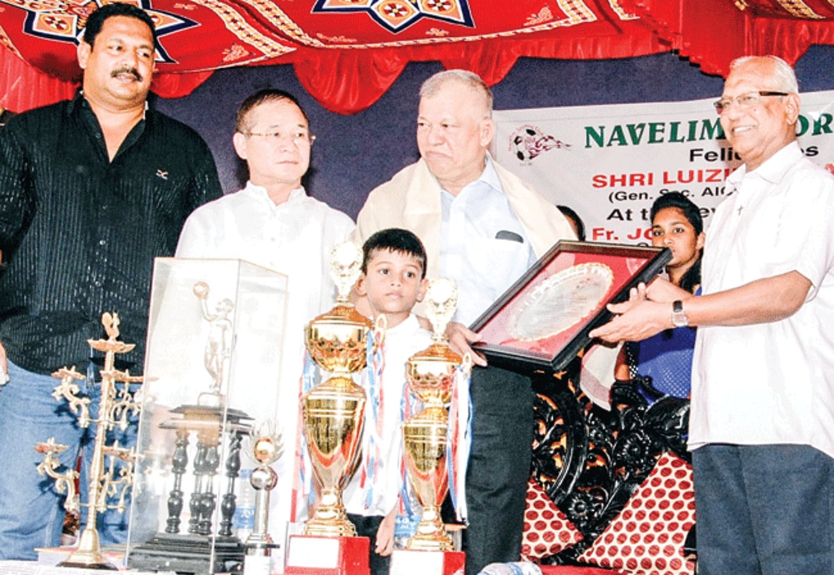 AICC General Secretary Luizinho Faleiro being felicitated at the hands of Navelim Parish Priest Fr Jose Rock Gonsalves at the Gold-Silver football finals at Navelim on Sunday.