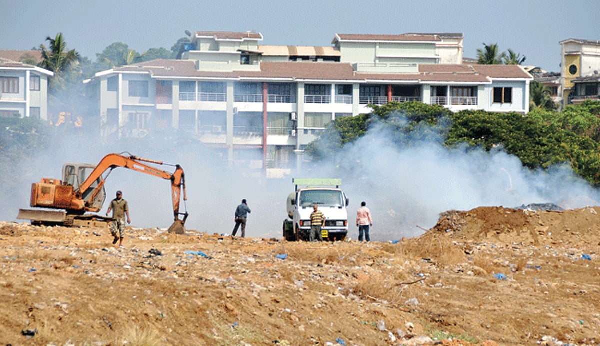 AN EYESORE IN THE CITY: Smoke billows out from burning garbage at the Campal Parade Grounds in Panjim causing pollution in the area on Monday.