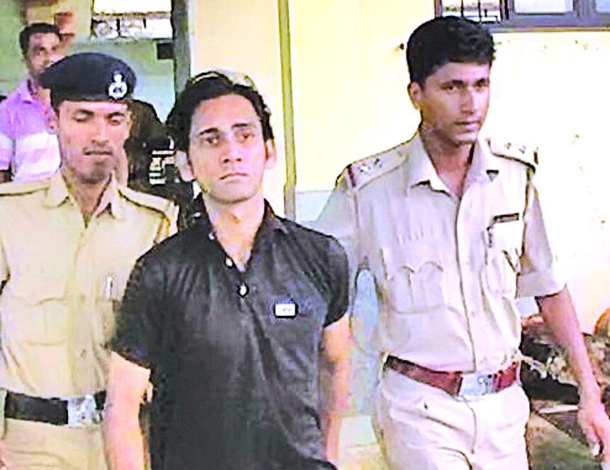 Abhijit Patil being taken to the Mormugao police station on Saturday.