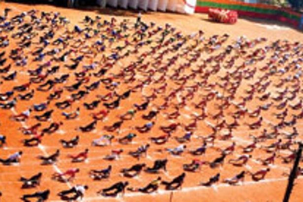 About 1,000 school students from Bicholim perform Surya Namaskara.