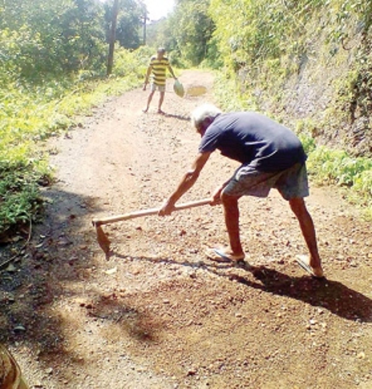 After KTC’s threat to stop plying  buses, Salgini villagers repair road
