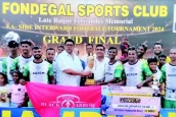 Agxem Sports Club lift Roque  memorial 9-a-side football trophy