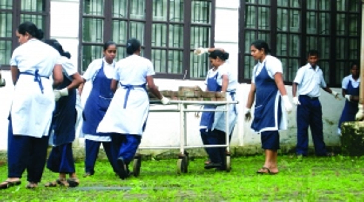 ...And Hospicio staff use stretchers to carry pavers