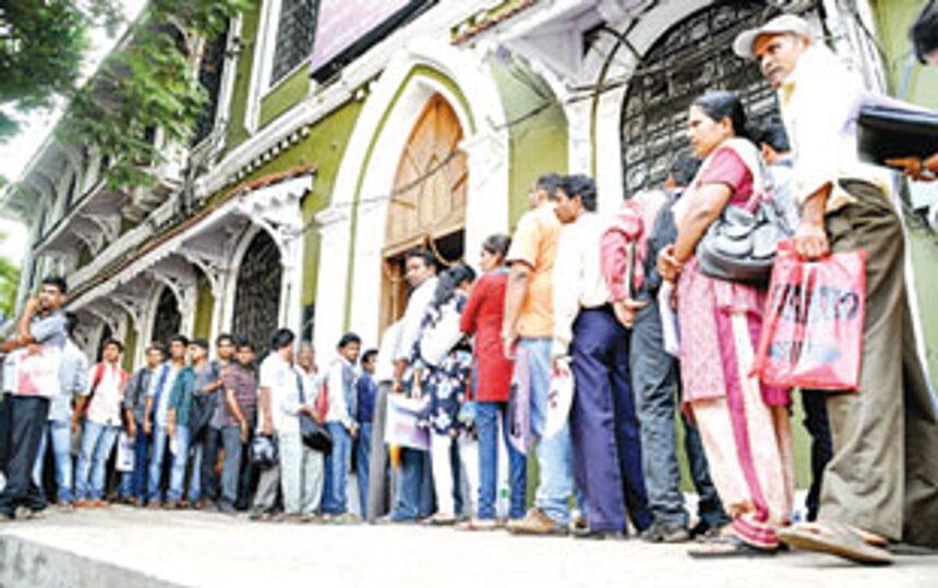 Applicants stand in a queue to submit their application forms for different posts 1 Applicants stand in a queue to submit their application forms for different posts