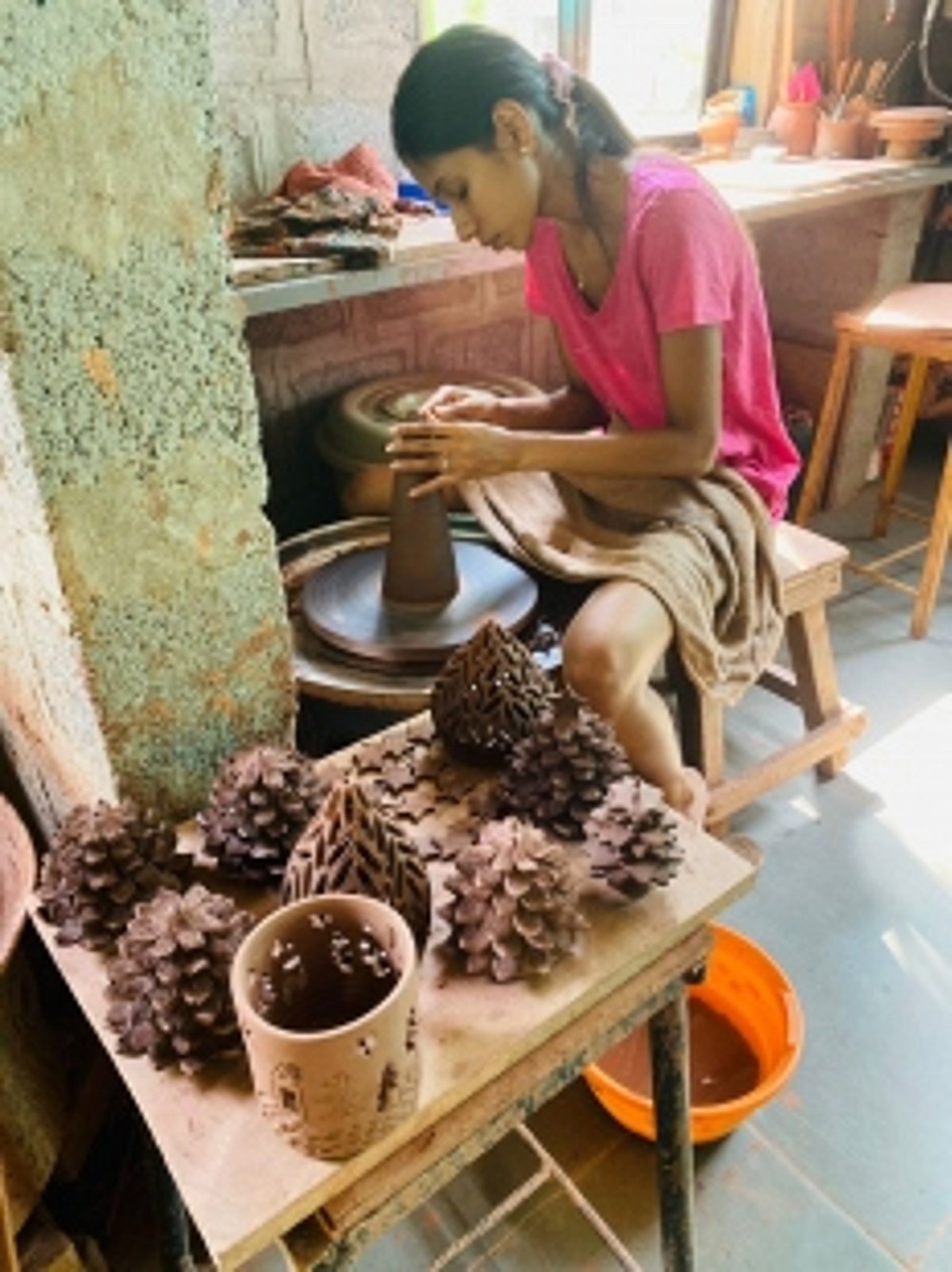 Arossim’s young potter Simonie Rego crafts clay Christmas decor