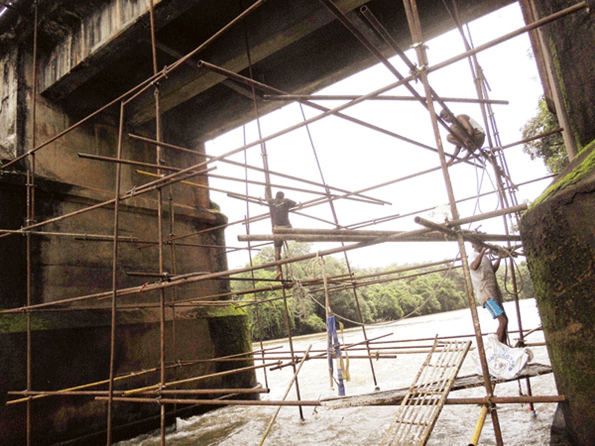 Authorities begin repair work on the Khandepar bridge.