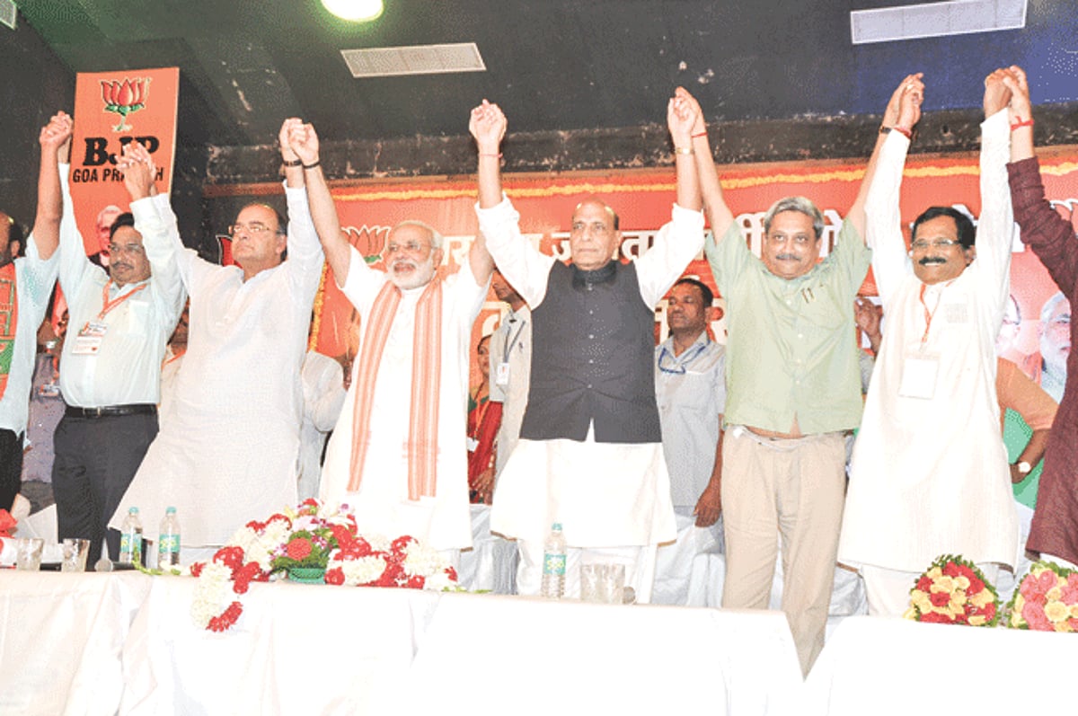 BJP Party bigwigs raise hands in show of strength in Taleigao on Sunday.