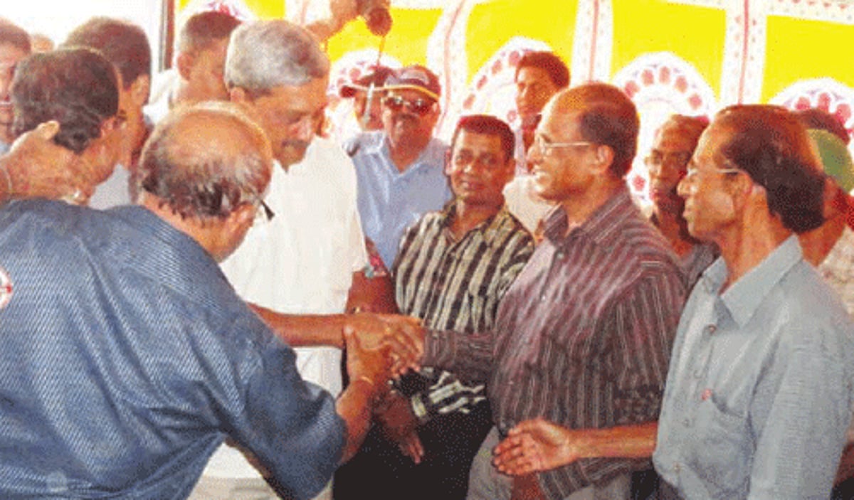BJP leader Manohar Parrikar offering handshakes to Goan seamen during an interaction at Margao on Wednesday.
