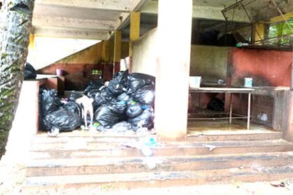 Bags containing garbage stacked in the market complex in Velsao.