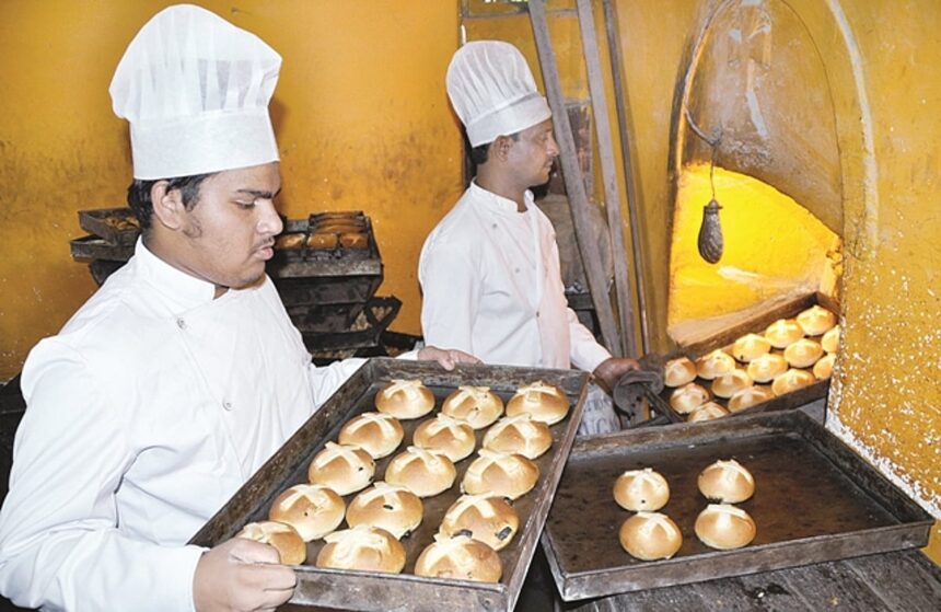 Bakers bake hot cross buns at a bakery in Panjim on Wednesday. Hot cross buns are traditionally eaten on Maundy Thursday, a day before Good Friday.