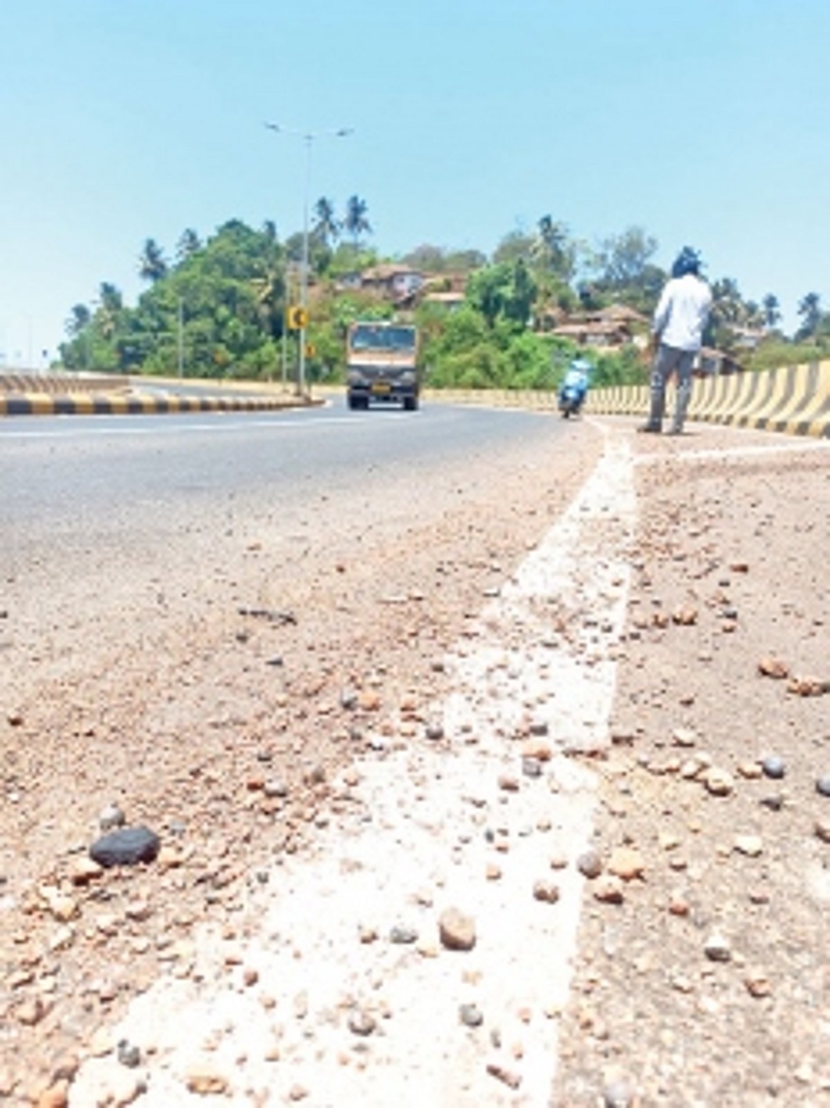 Bauxite stones lying by the roadsides pose danger  to two-wheeler riders