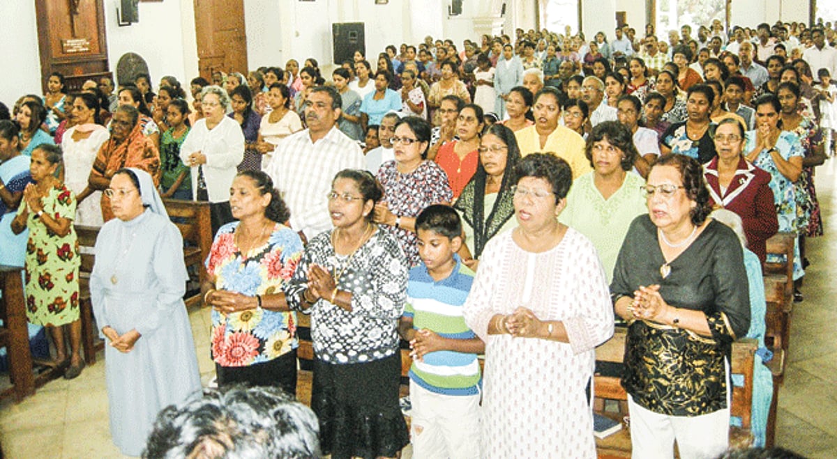 Benaulim Parishioners participating in a prayer service at the St John the Baptist Church on Friday.