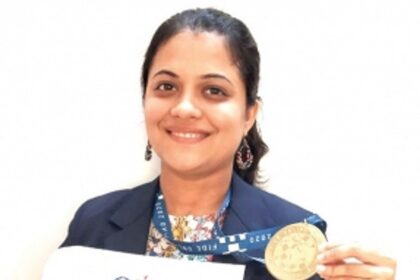Bhakti receives her  gold medal won in Online Olympiad