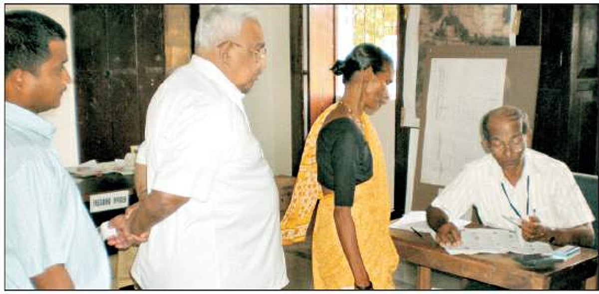 Birthday boy Dr Wilfred de Souza stands in queue to cast his vote in Saligao. Photos by Santosh Mirajkar and Anil Shankhwalker