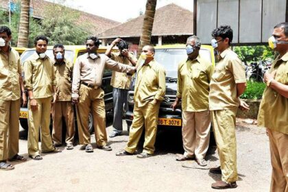 Black and yellow taxi operators at the Margao railway station wearing masks.     Photo by: Santosh Mirajkar