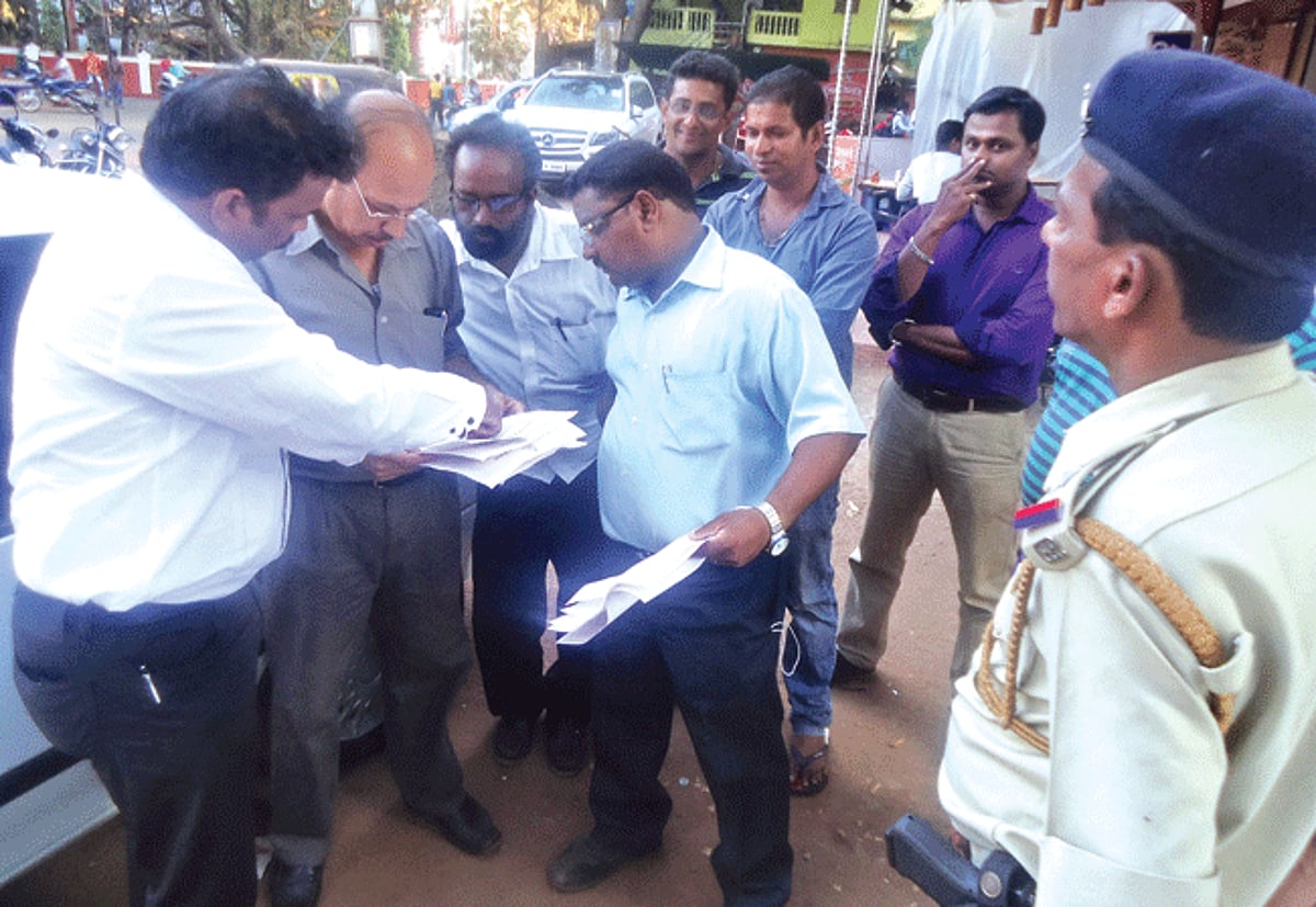 Calangute MLA Michael Lobo makes a point to an Election Commission official at Arpora.