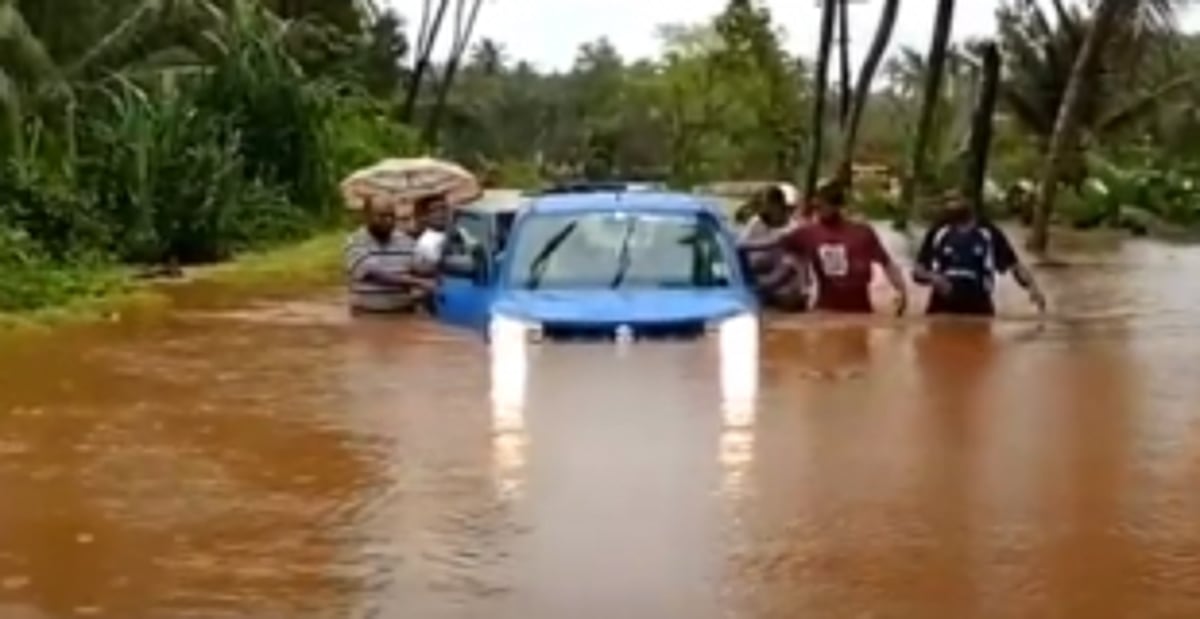 Car, occupants saved  from drifting at Paroda