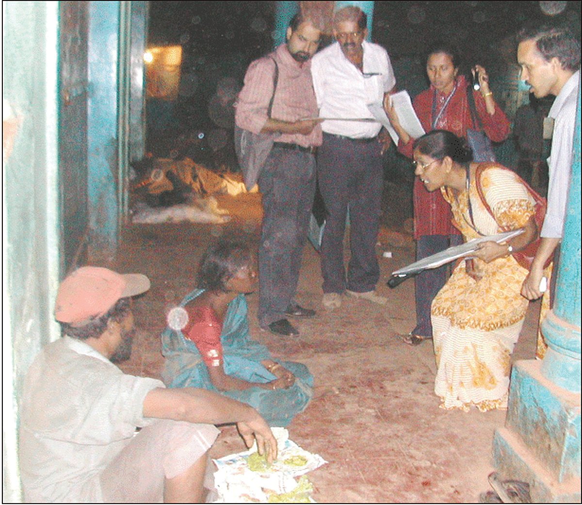 Census officials interacting with a migrant family in the Gandhi market as part of the houseless population enumeration on Monday.