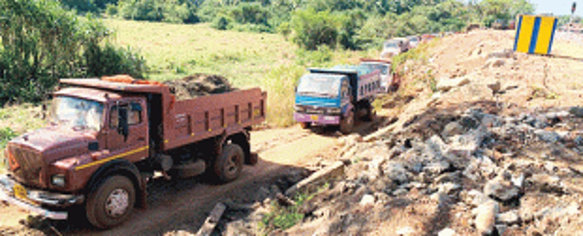 Chandor locals stop trucks passing through  Church property to dump mud into lake