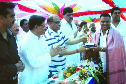 Chief Minister Digambar Kamat felicitating Rachol Sarpanch and President of Original Goans Scheduled Tribes Association Joseph Vaz at the ST convention at Curtorim.