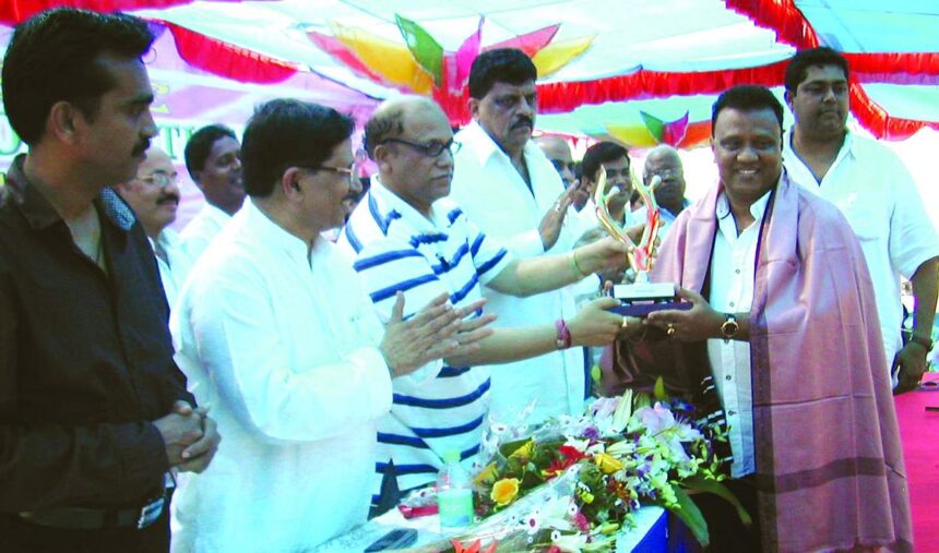 Chief Minister Digambar Kamat felicitating Rachol Sarpanch and President of Original Goans Scheduled Tribes Association Joseph Vaz at the ST convention at Curtorim.
