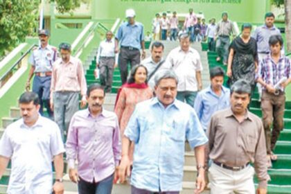 Chief Minister Manohar Parrikar along with Damu Naik leaving the Chowgule education complex.