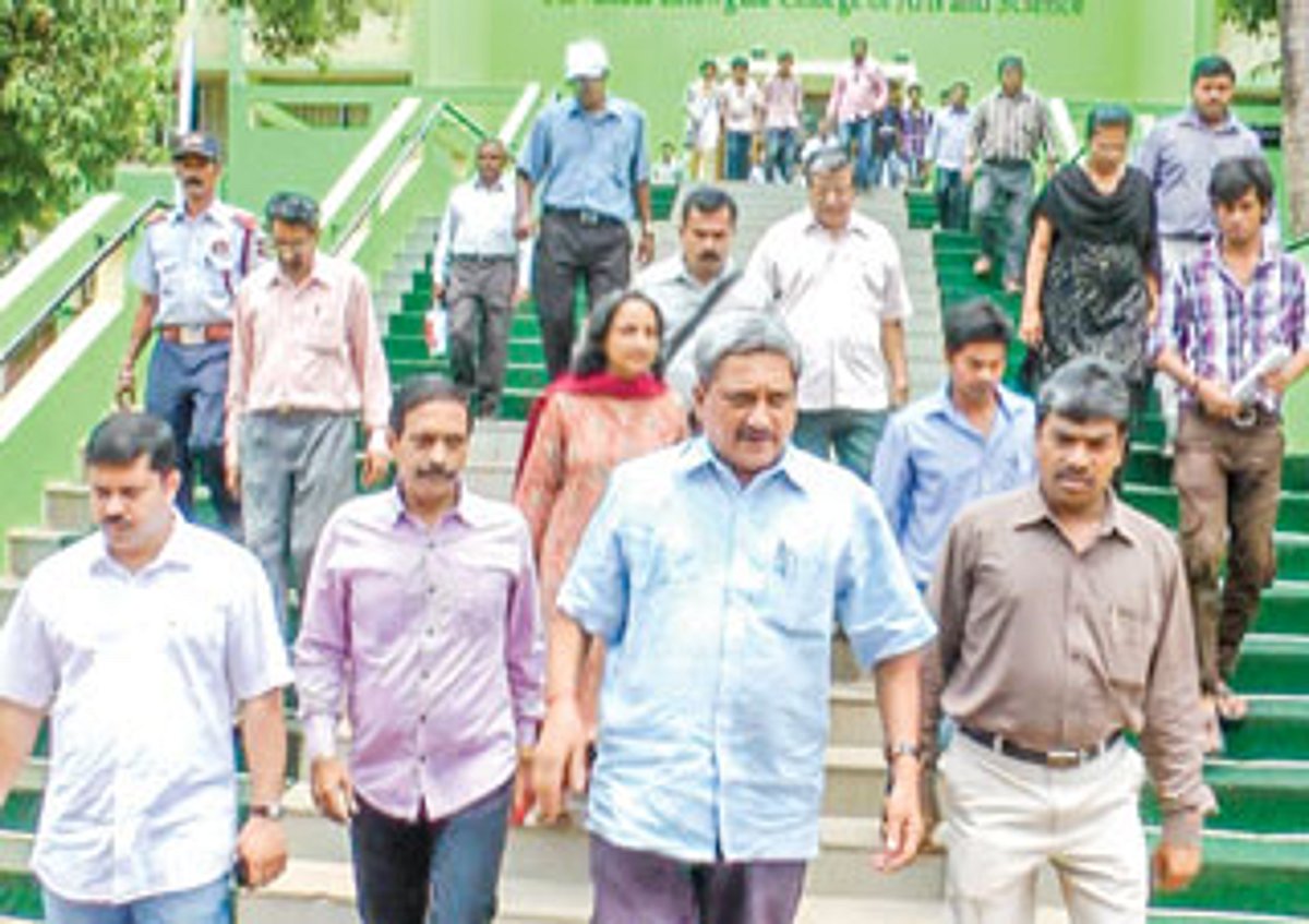 Chief Minister Manohar Parrikar along with Damu Naik leaving the Chowgule education complex.