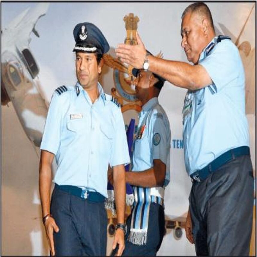 Chief of the Air Staff, P V Naik directing Group Captain Sachin Tendulkar to address the audience after conferring on him the honorary rank of Group Captain in New Delhi on Friday.