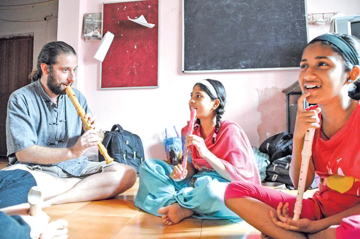 Children at Hamara School in Porvorim learning to play the flute
