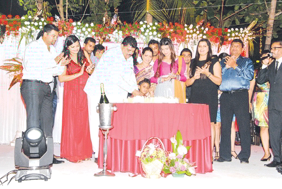 Churchill Alemao cutting the birthday cake in the presence of his family at the Blasco Executive, Navelim on Thursday.